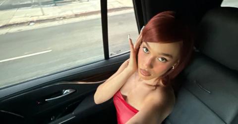 Nezza sitting in a car.