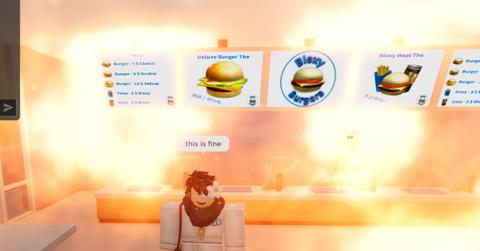 'Roblox' Player standing inside a burning Bloxy Burgers.