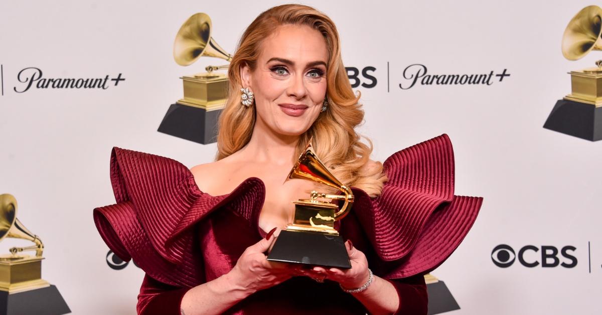 Adele holding a Grammy