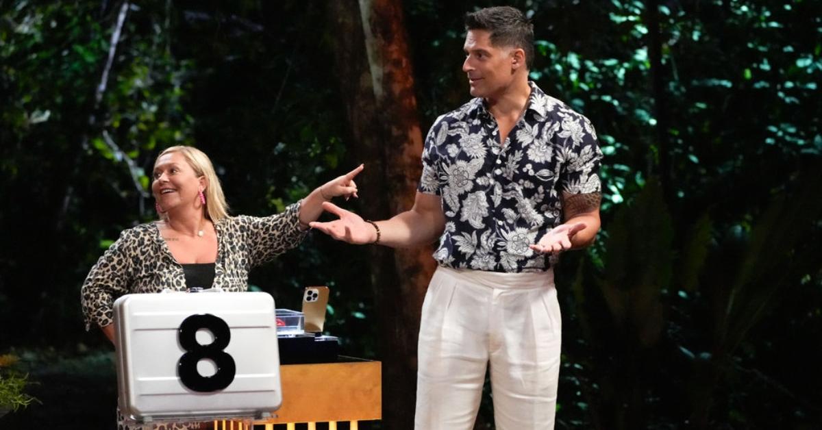 A 'Deal or No Deal Island' contestant points to host Joe Manganiello