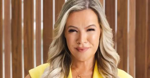 Maria Morris from 'Selling Dubai' poses in a yellow dress.