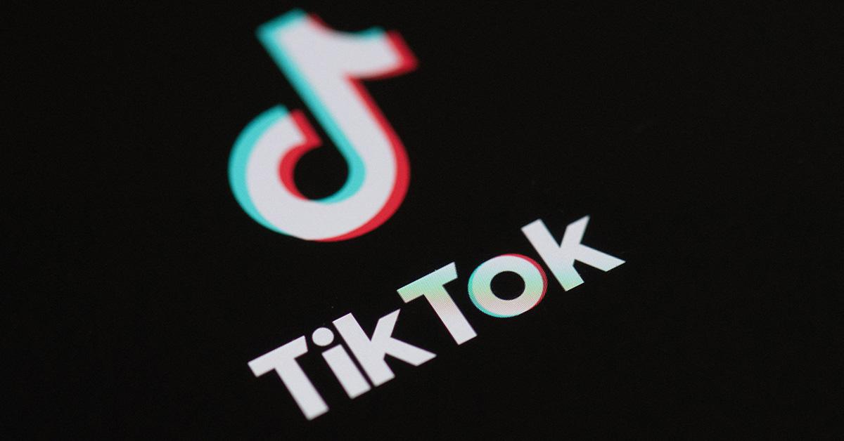 The TikTok logo against a black backdrop. 