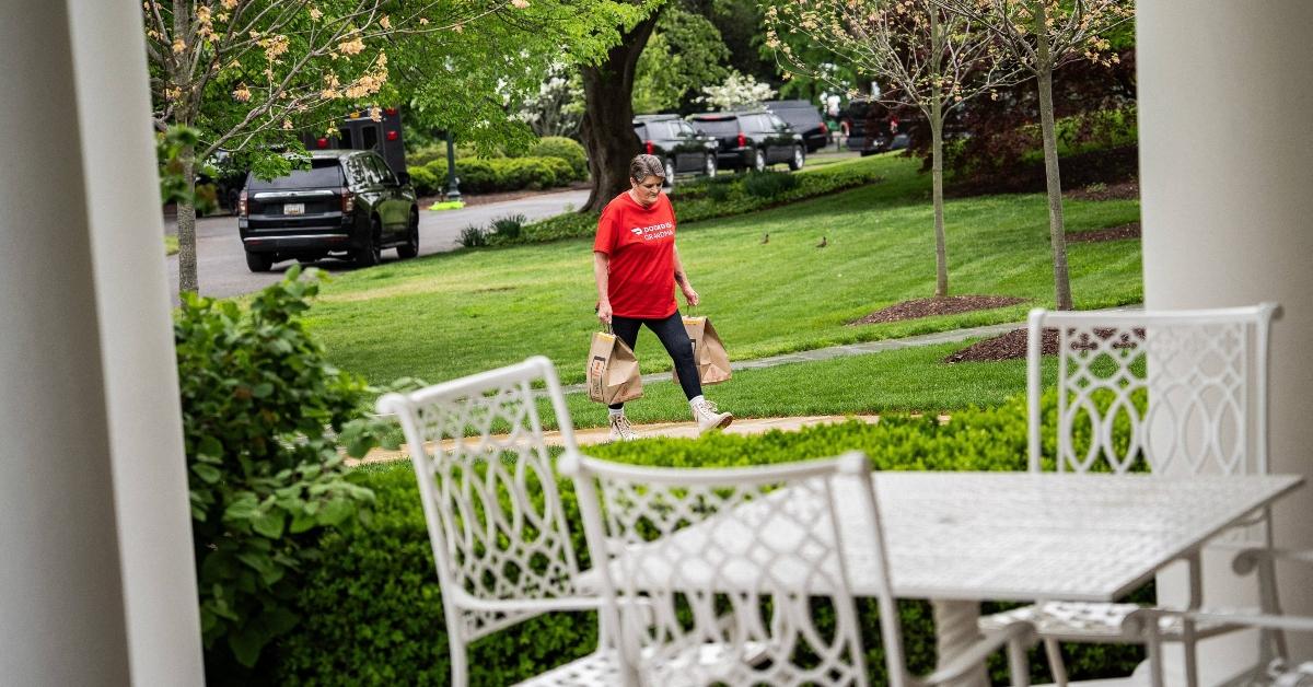The Doordash grandma walks up to the Oval Officer with Trump's order.