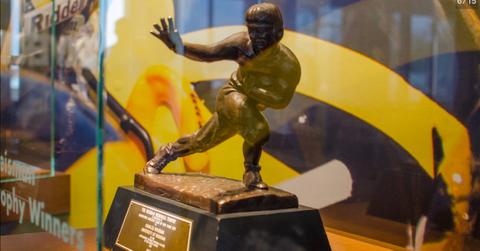 The Heisman Trophy in a glass case.