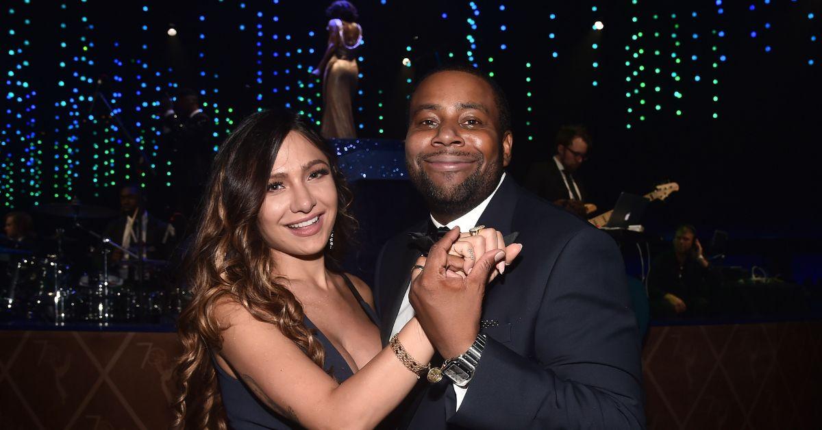 (l-r): Christina Evangeline and Kenan Thompson holding hands and smiling.