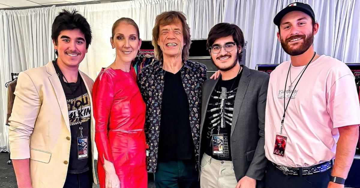 Celine Dion and her sons posing together with Mick Jagger.