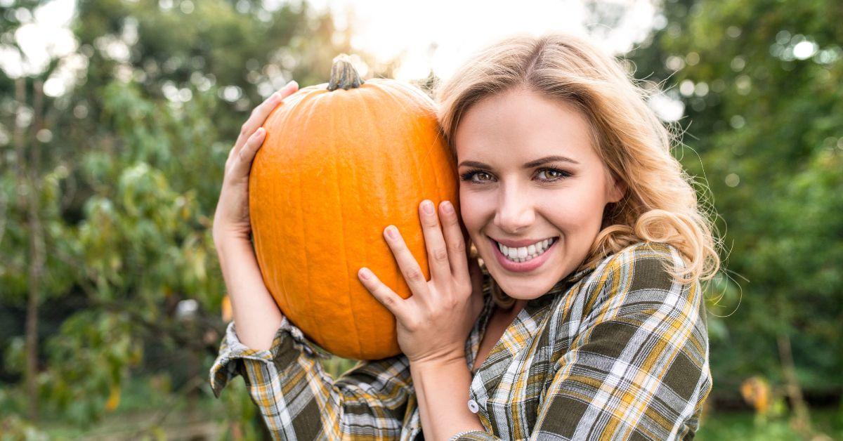 woman holding pumpkin