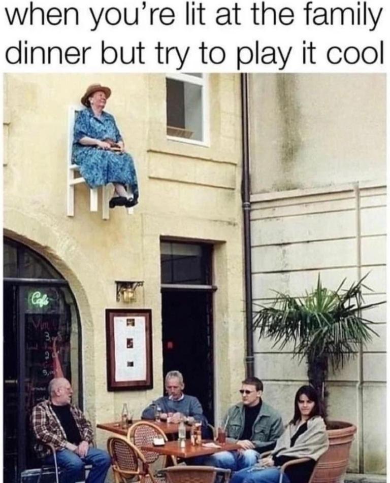 A woman sits in a chair high above her family at a dining table