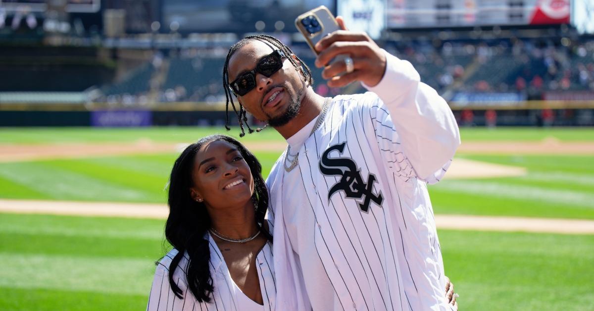  Gymnast Simone Biles and Jonathan Owens of the Chicago Bears record a video on the field.