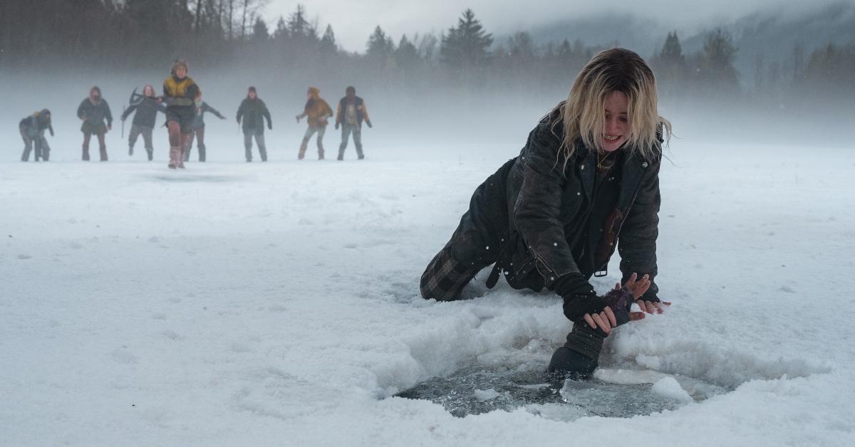 A distraught Natalie (Sophie Thatcher) tries to pull Javi (Luciano Leroux) out of the ice.