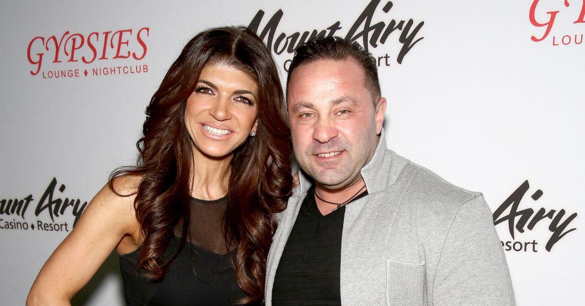 (l-r): Teresa and Joe Giudice smiling at an event.