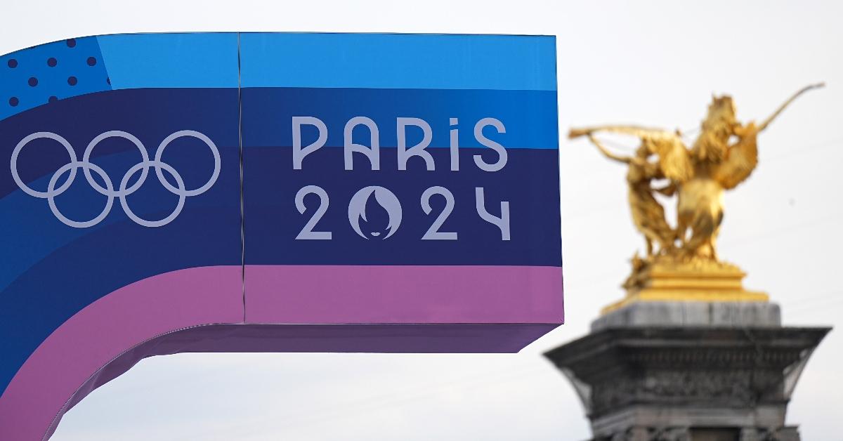 24 July 2024, France, Paris: Before the Summer Olympics, Olympia Paris 2024, a display board with the logo of the Games and the Olympic rings. Photo: Michael Kappeler/dpa (Photo by Michael Kappeler/picture alliance via Getty Images)