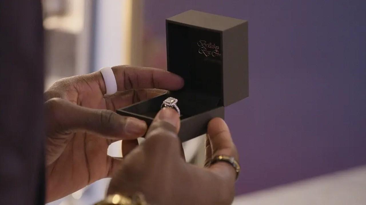 A man on 'Love Is Blind' holding a box with an engagement ring in it