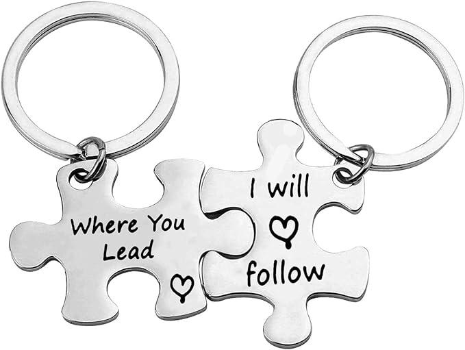 Two puzzle shaped keychains that read "where you lead I will follow"