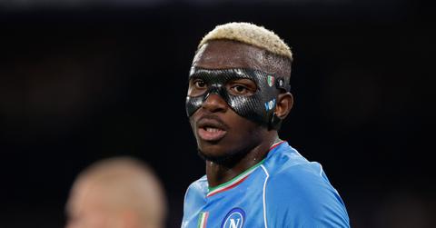 Victor Osimhen wearing a face mask during a Napoli match.