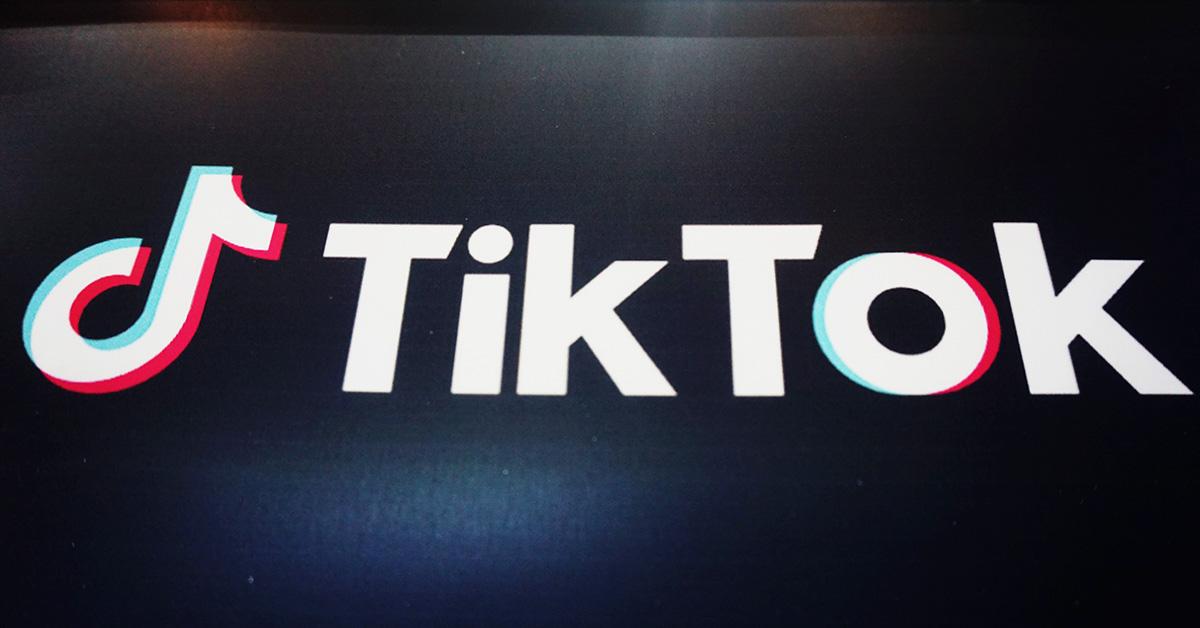 TikTok logo against a black backdrop 