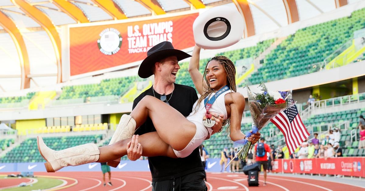 Tara Davis, second place in the Women's Long Jump Final, celebrates with Hunter Woodhall 