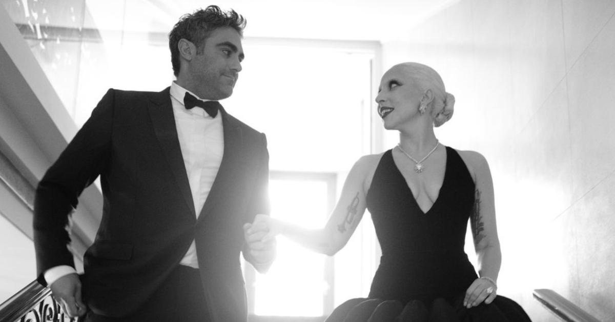 Lady Gaga and Michael Polansky holding hands walking down steps in black-and-white photo posted to Gag's Instagram, Joker Folie a Deux premiere