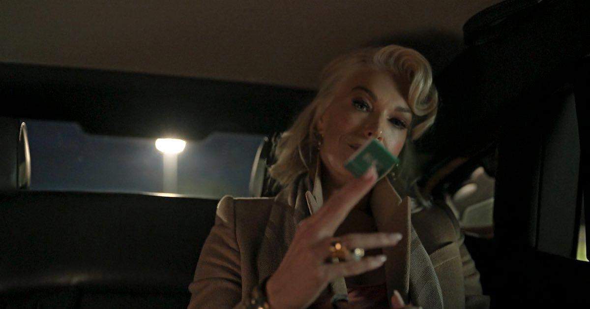 Rebecca holding the green matchbook in 'Ted Lasos'