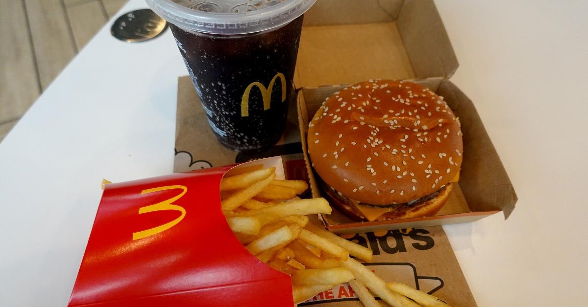 mcdonalds cheeseburger meal with fries and coke