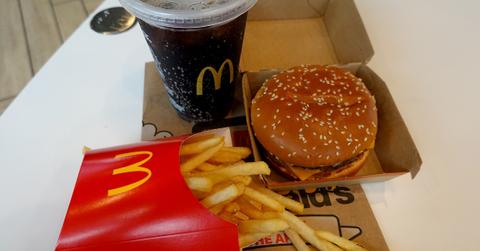 mcdonalds cheeseburger meal with fries and coke