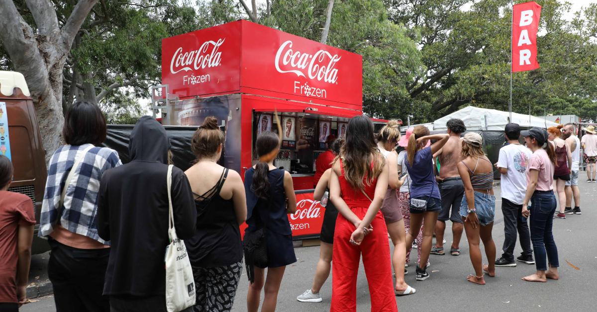 People wait on line at a Coca-Cola pop-up at Mrs Macquaries Chair in Australia on Dec. 31, 2018.