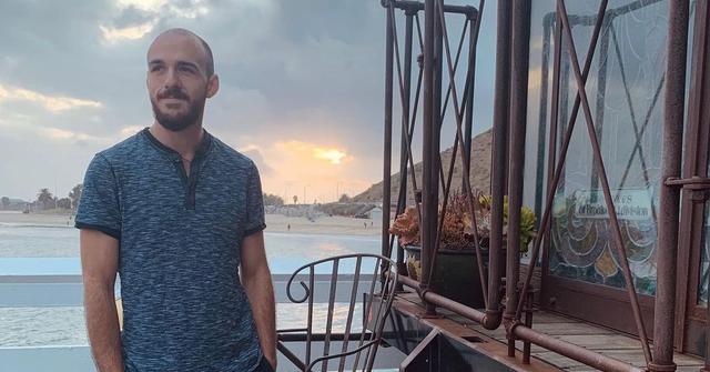 Brian Laundrie standing near the ocean