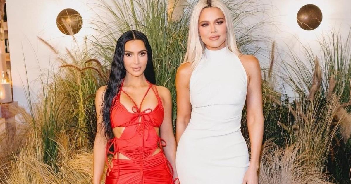 Kim and Khloé in a red dress and white dress