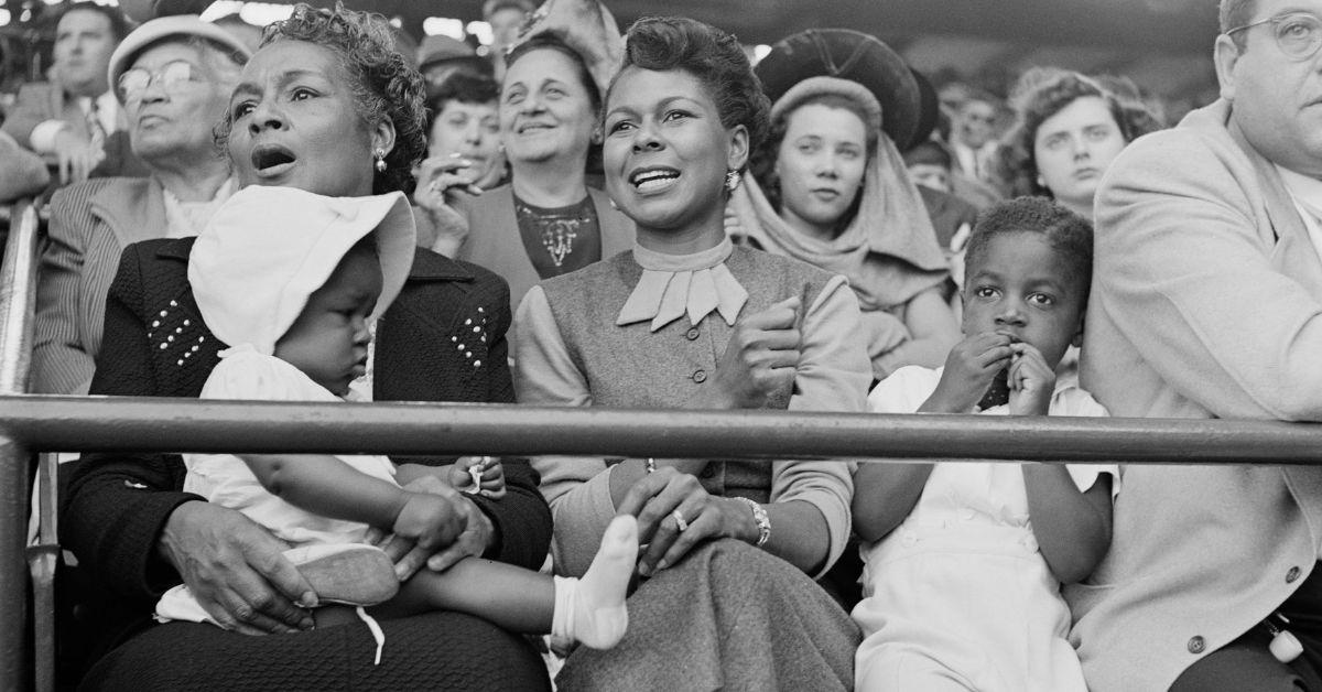 Rachel Robinson cheering Jackie on during one of his games. 