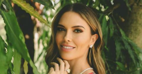 Bettina Anderson with her hand on her chin.