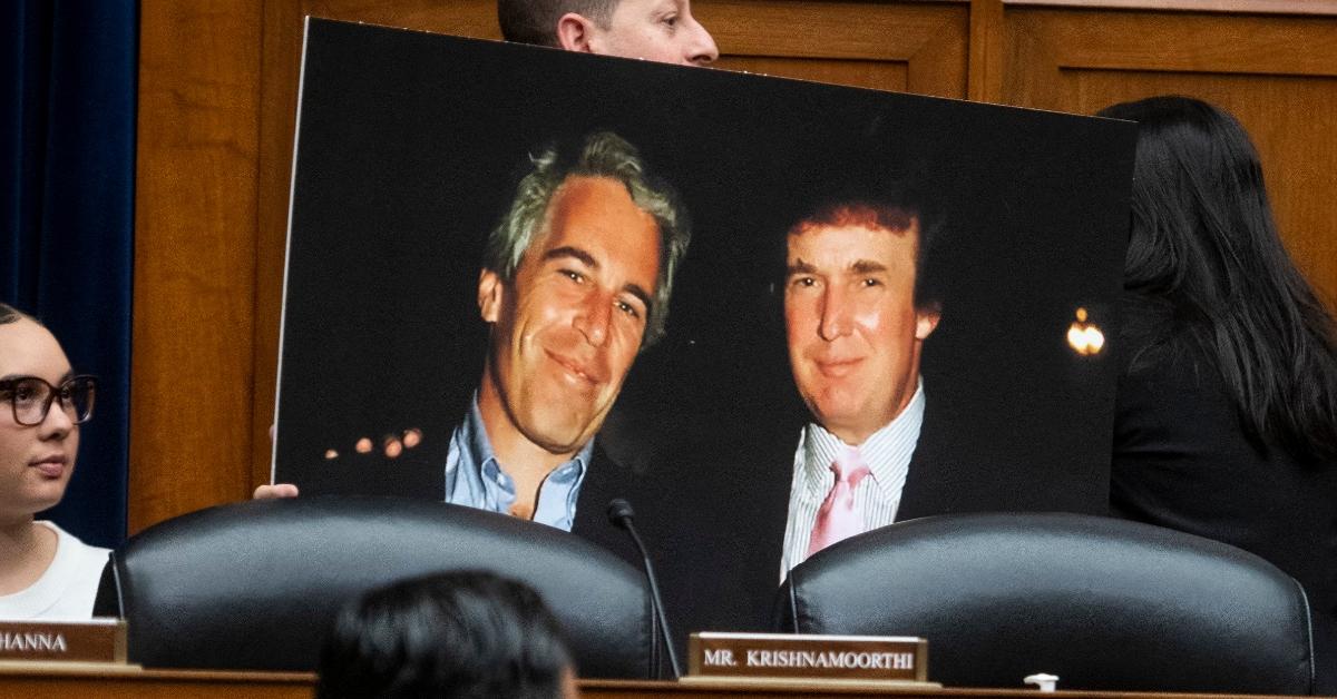 United States Representative Jared Moskowitz holds a photo board featuring a photo of Jeffrey Epstein and Donald Trump