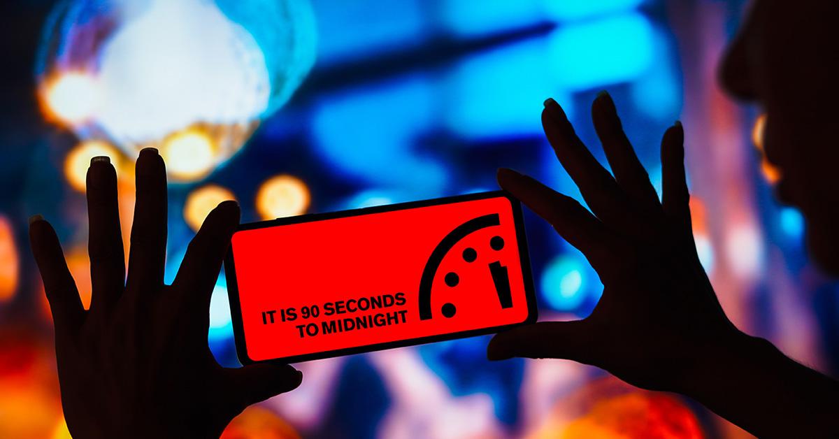 The Doomsday Clock at 90 seconds to midnight on a phone screen. 