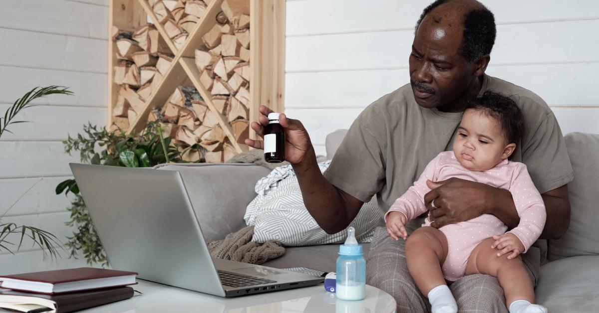 dad holding baby and medicine