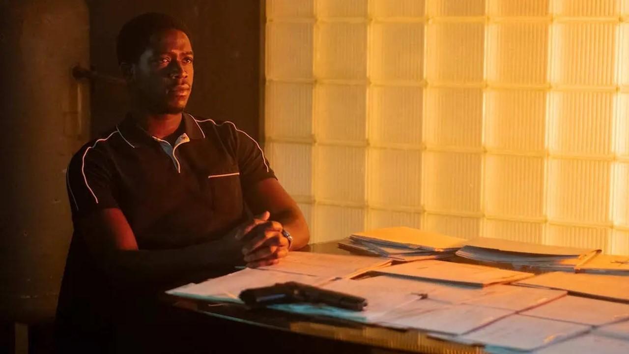 Franklin Saint sitting at a table in 'Snowfall'