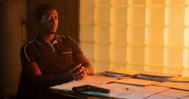 Franklin Saint sitting at a table in 'Snowfall'