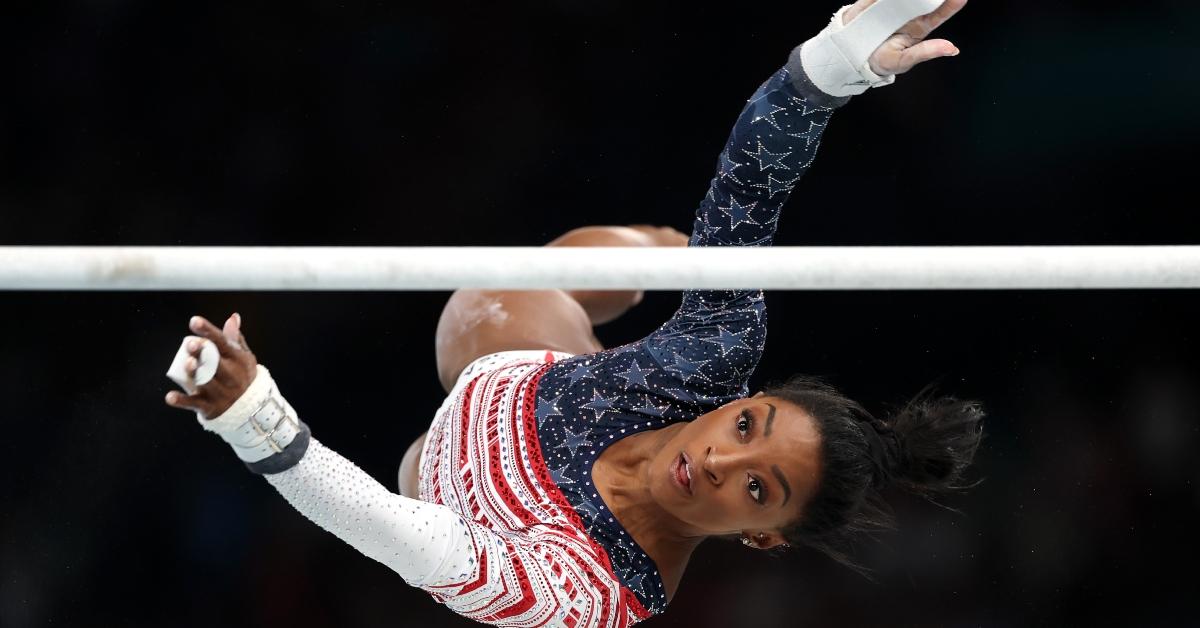 Simone Biles of Team United States in action on the uneven bars at the 2024 Paris Olympics.