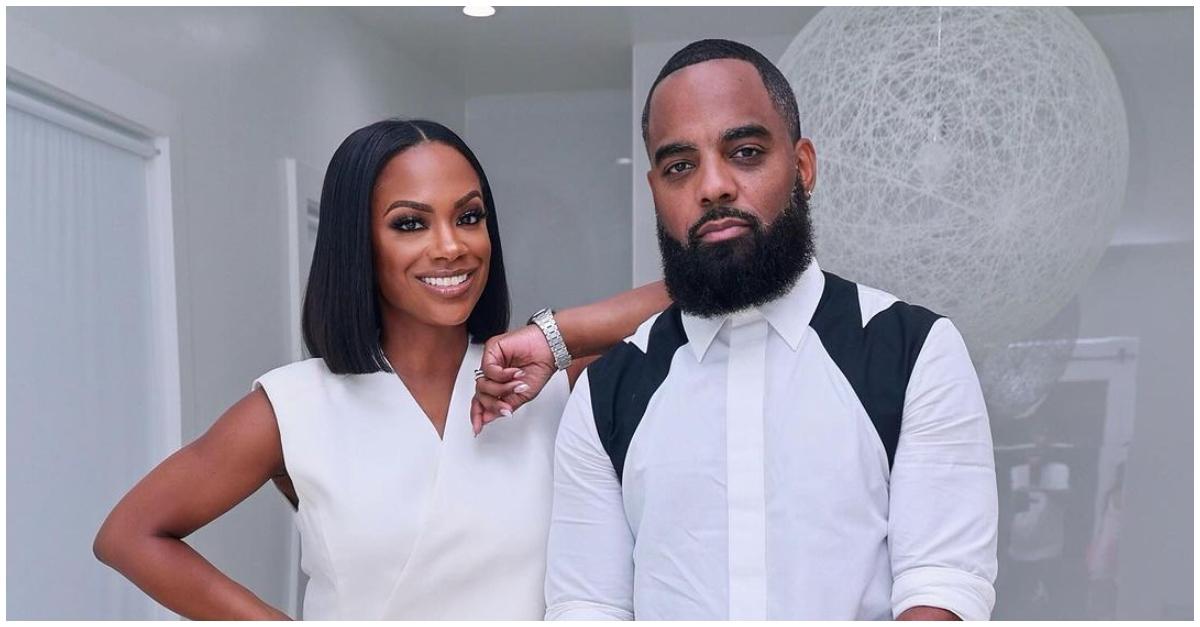 (l-r): Kandi Burruss and Todd Tucker posing in their house.