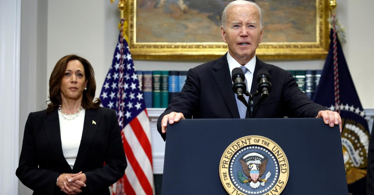 Kamala Harris stands behind Joe Biden at the White House