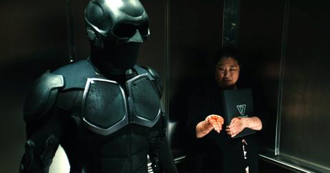 Black Noir (Nathan Mitchell) and a woman from accounting (Esther Chung)