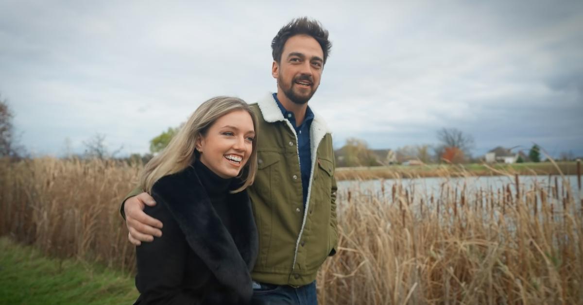 Grace and Brandon walk by a pond on Farmer Wants a Wife