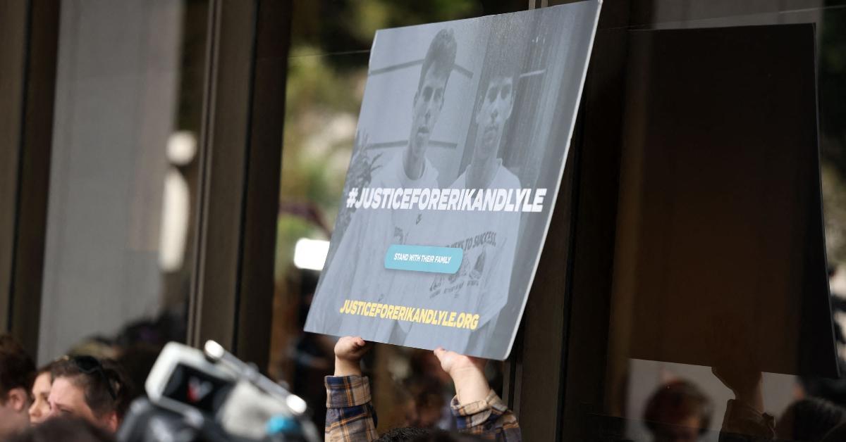 A Menendez brothers supporter holds up a sign outside of the courhouse