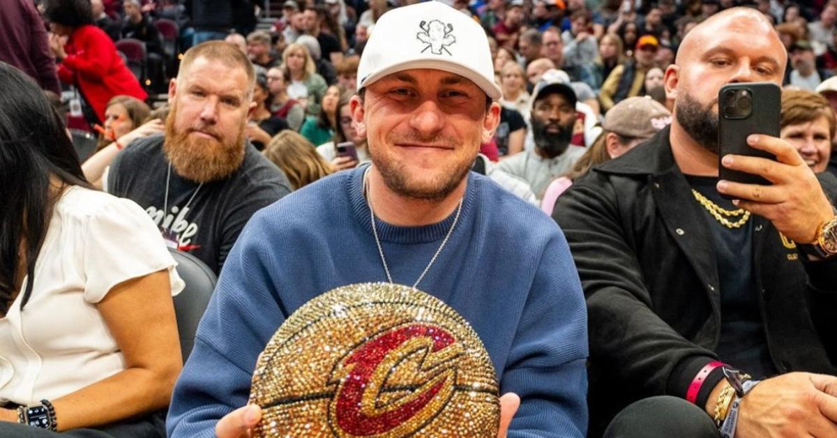 Johnny Manziel holding a crystallized basketball with the Cleveland Cavaliers logo