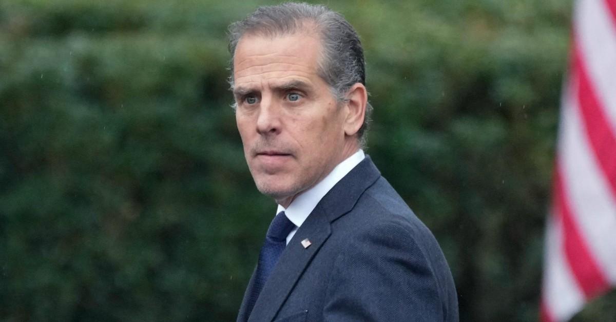 Hunter Biden looking off to the side at an event with his father who is out of frame of the photo