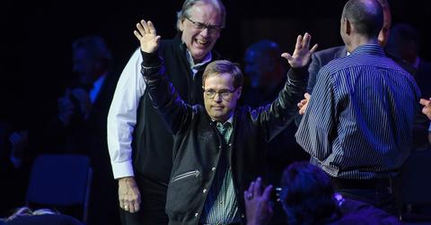 Joey Moss at an NHL Classic event waving to the crowd.