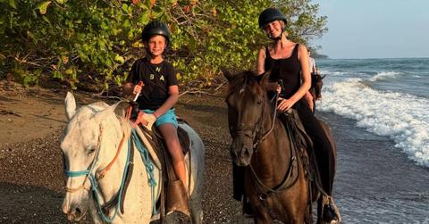 Ivanka Trump and her son on horses on the beach