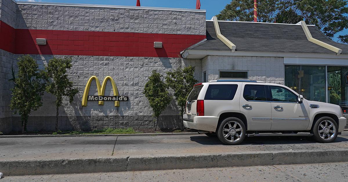 A car at a McDonald's drive-through. 