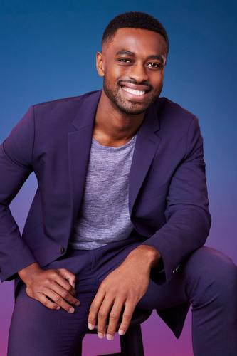 Marvin poses in front of a blue-purple ombré background for his official 'The Bachelorette' Season 21 portrait.