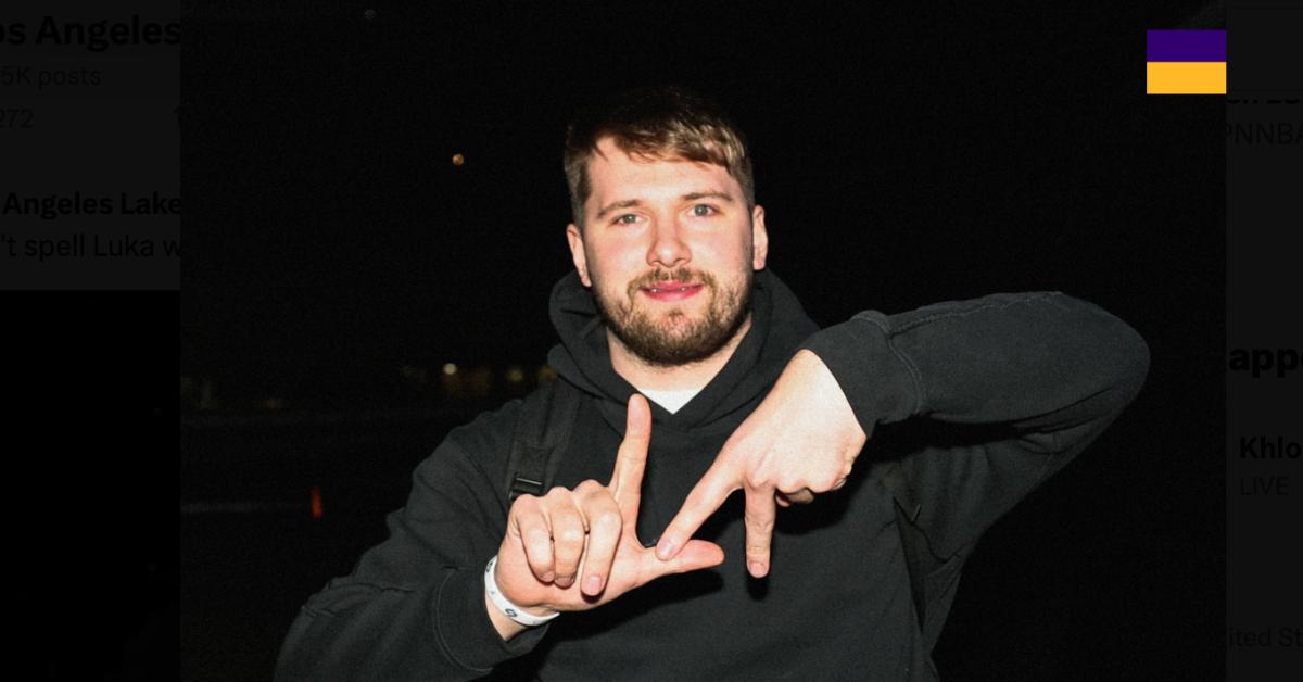 Luka Dončić holding up an "L" and "A" with his hands after Lakers trade.