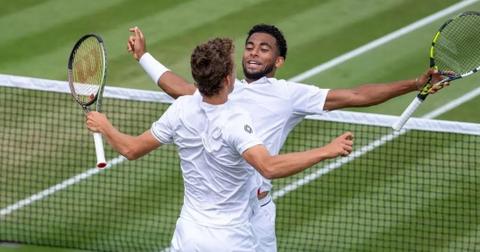 Luca Van Assche and Arthur Fils during a men's doubles match at the 2023 Wimbledon in London