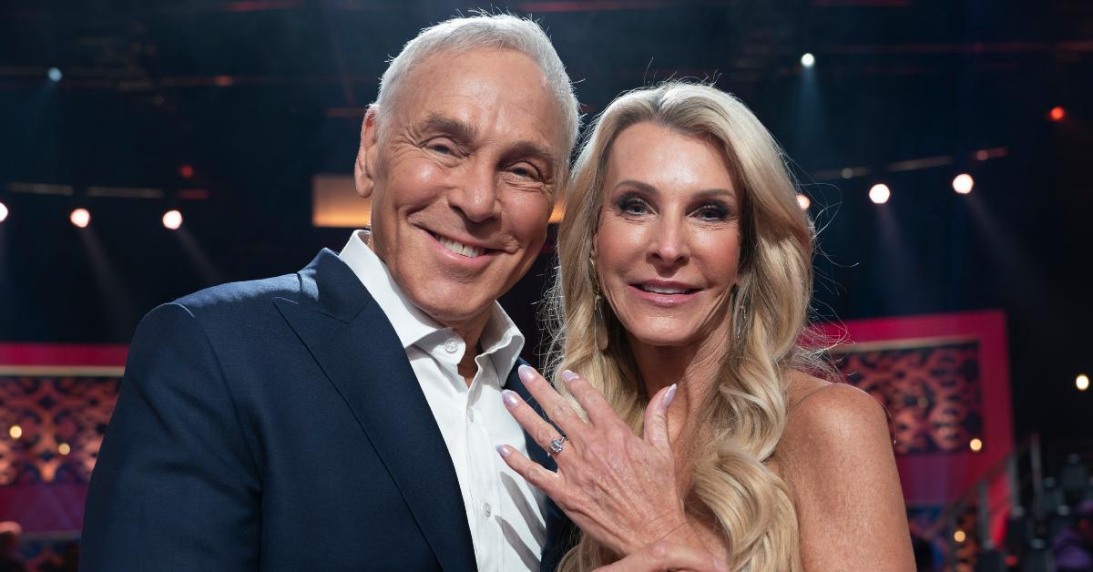 Joan Vassos shows off her engagement ring while posing with Neil Lane.